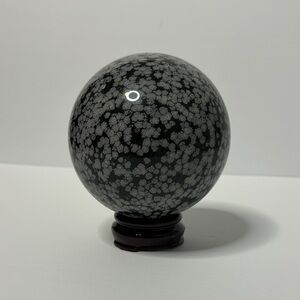 Large snowflake obsidian sphere with stand.